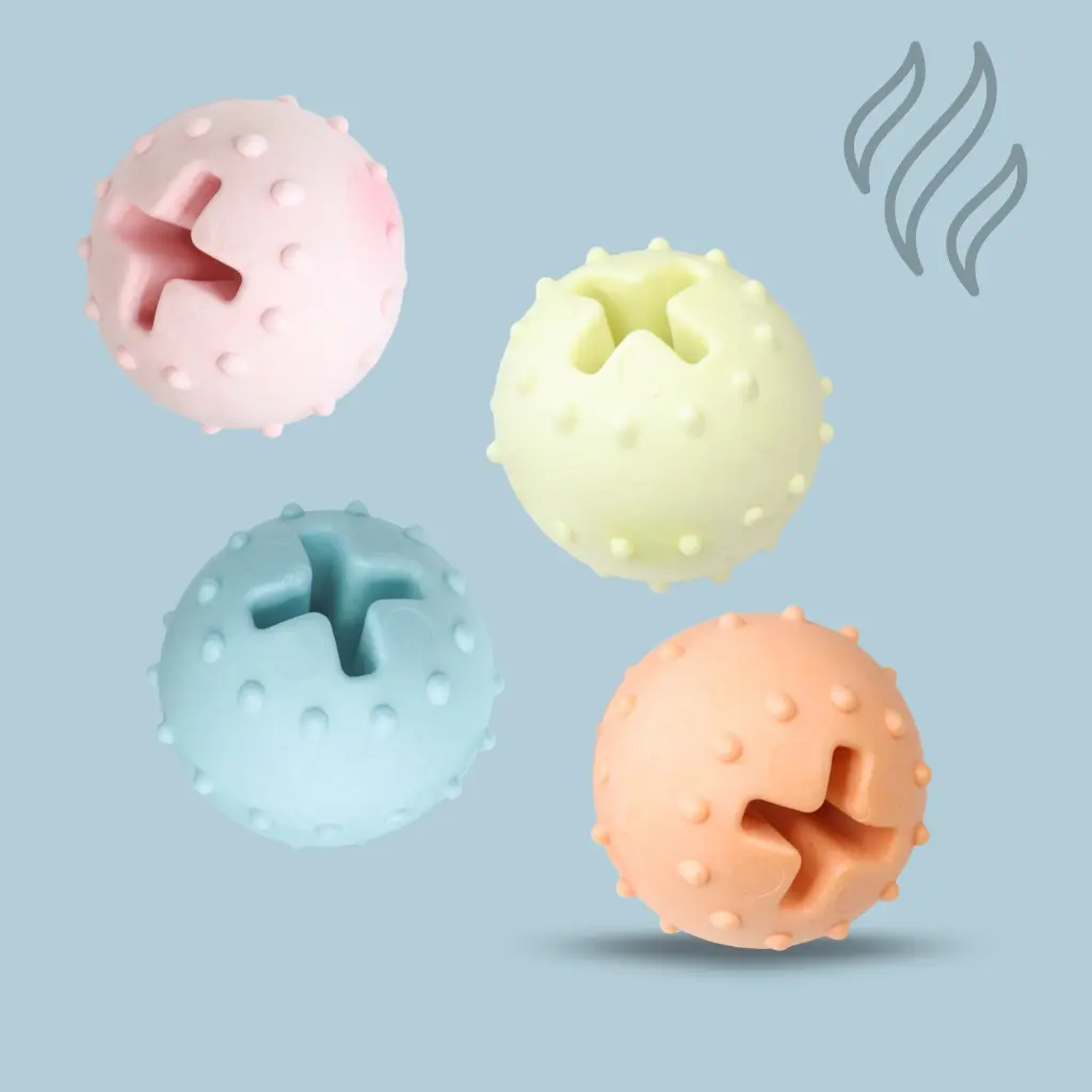 Mordillo pelota con puntos dosificadora color pastel