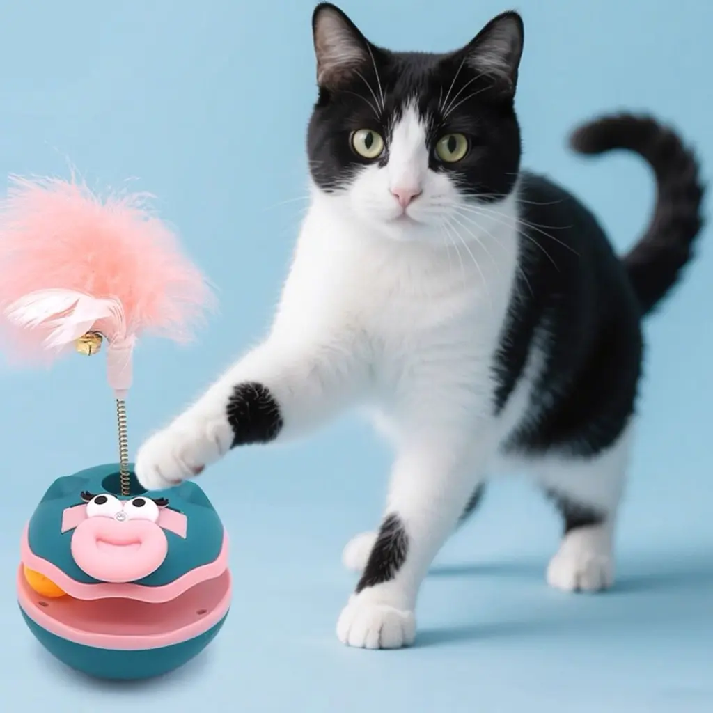 Juguete trompo mono con pluma